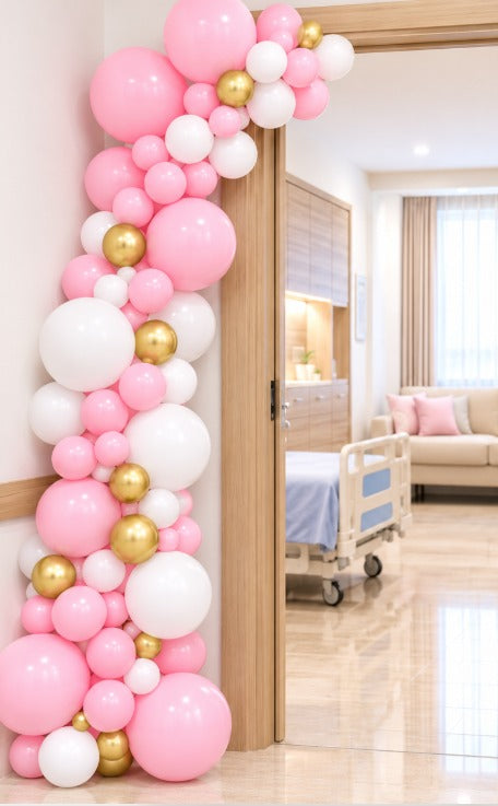 Pink, white and gold balloon door arch