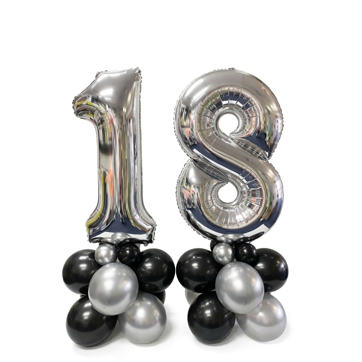 Silver foil number 18 balloons on black and chrome silver balloon clusters