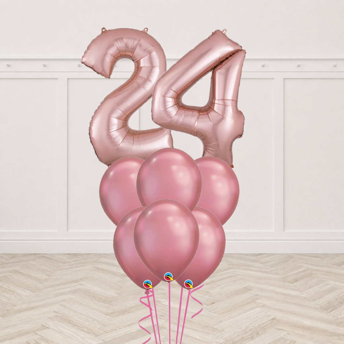 Two rose gold number foil balloons with a bunch of six rose gold chrome latex balloons