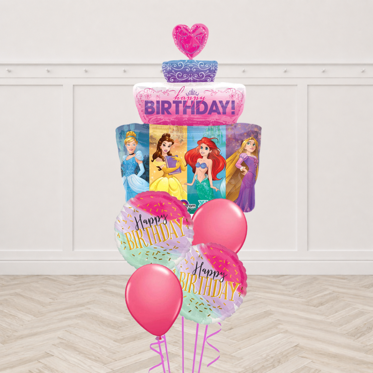 Disney Princess cake shaped foil balloon with Cinderella, Belle, Ariel and Rapunzel, two Happy Birthday round foils and two pink latex balloons