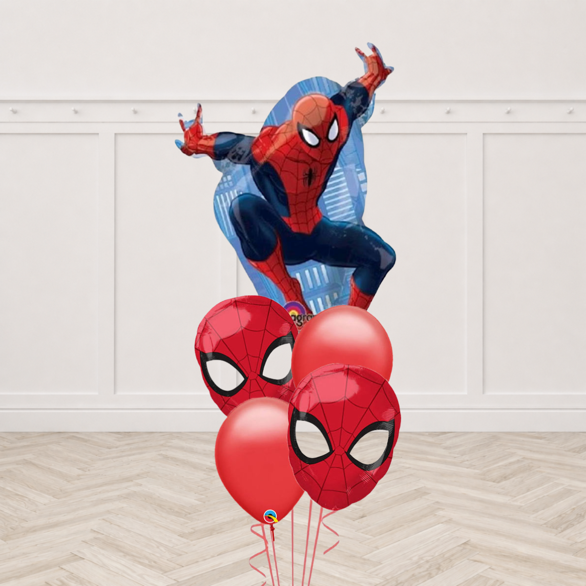 Spider-Man full body shaped foil balloon with two Spider-Man face round foils and two red latex balloons