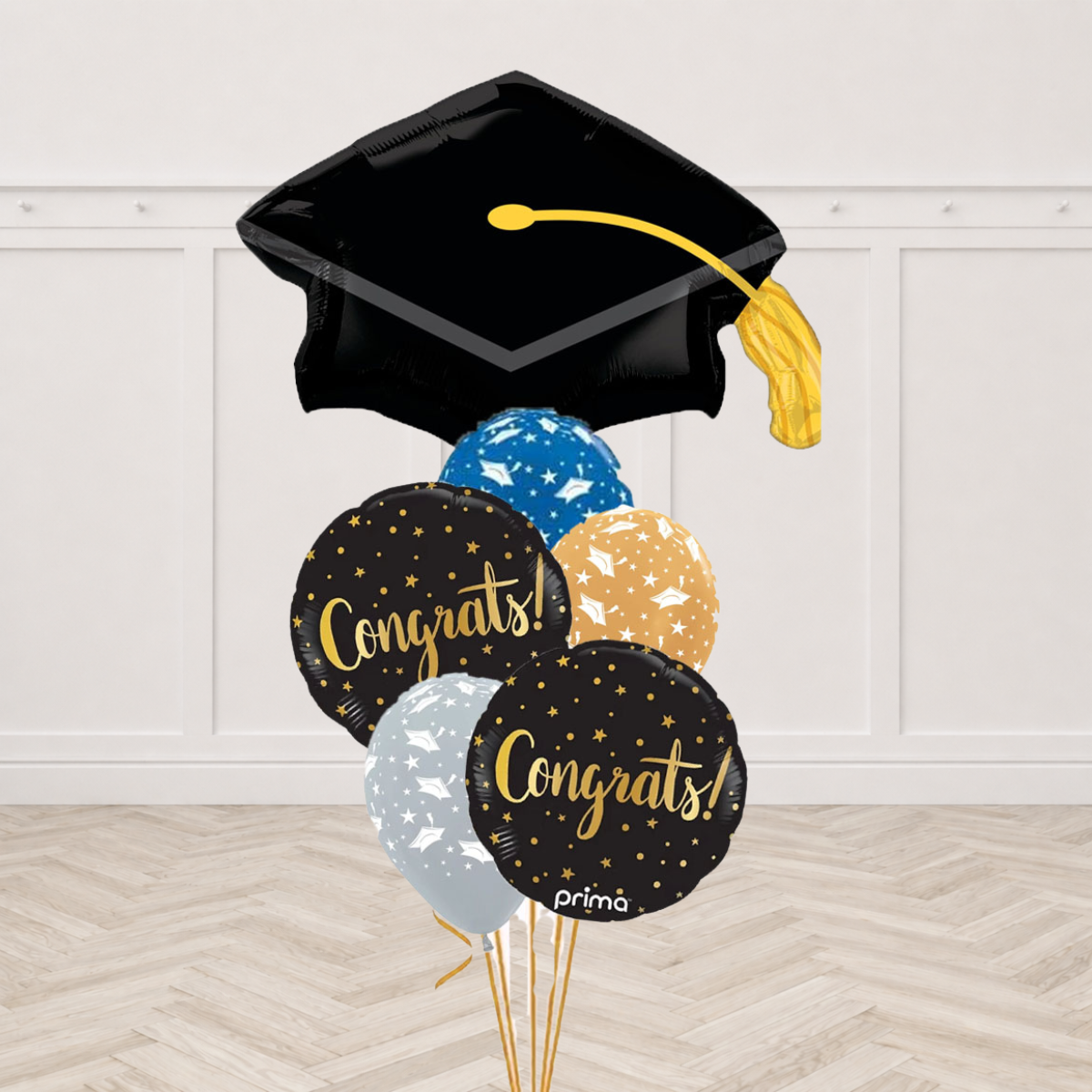 Black graduation cap shaped foil balloon with two black Congrats round foils and three blue, gold and silver latex balloons