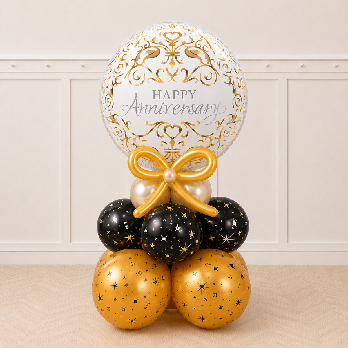 Happy Anniversary bubble balloon with gold bow on black and gold base