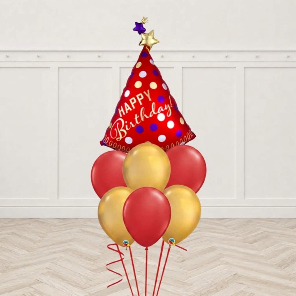 Red polka-dot Happy Birthday cone-shaped foil balloon with gold and purple star toppers and red and gold latex balloons