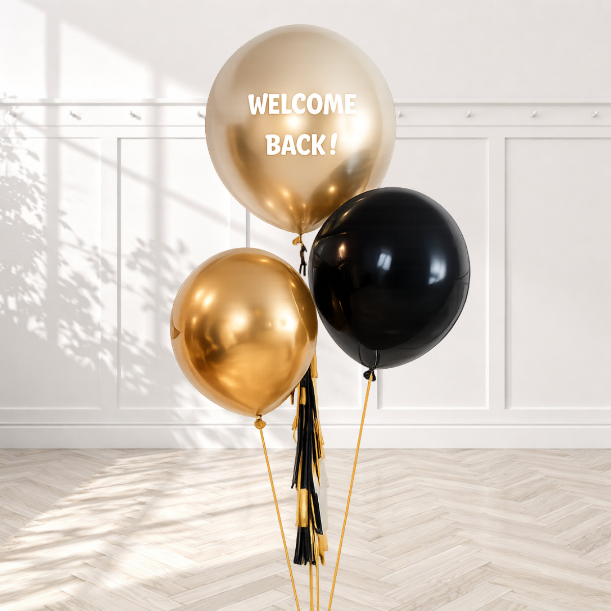 Gold and black balloons with 'WELCOME BACK!' text