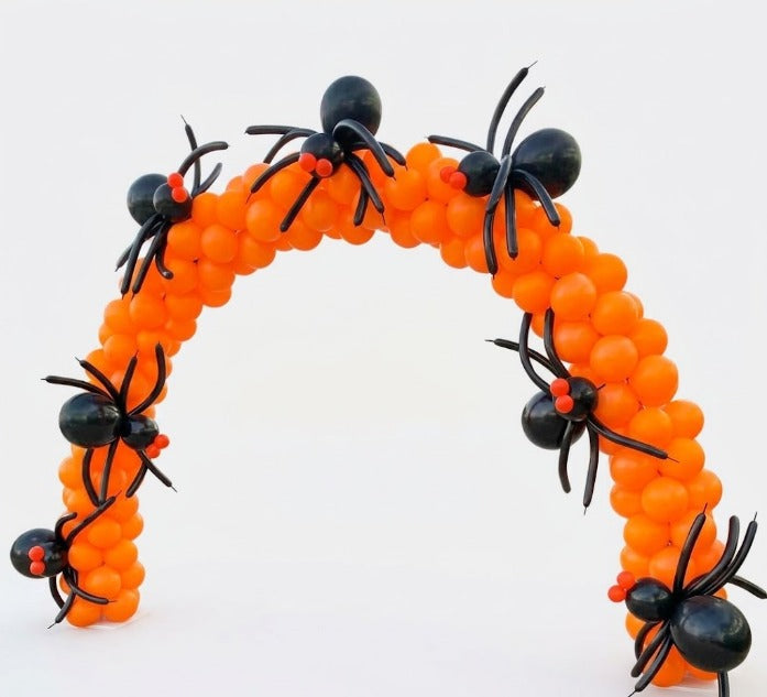 Halloween balloon arch in orange latex covered with large black spider balloon figures