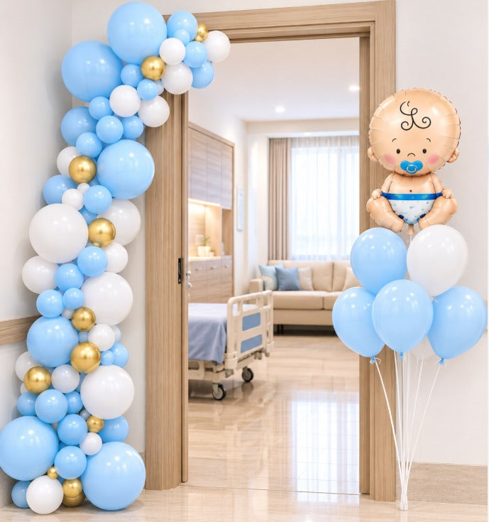 Blue, white and gold balloon door arch with a baby boy foil balloon bouquet