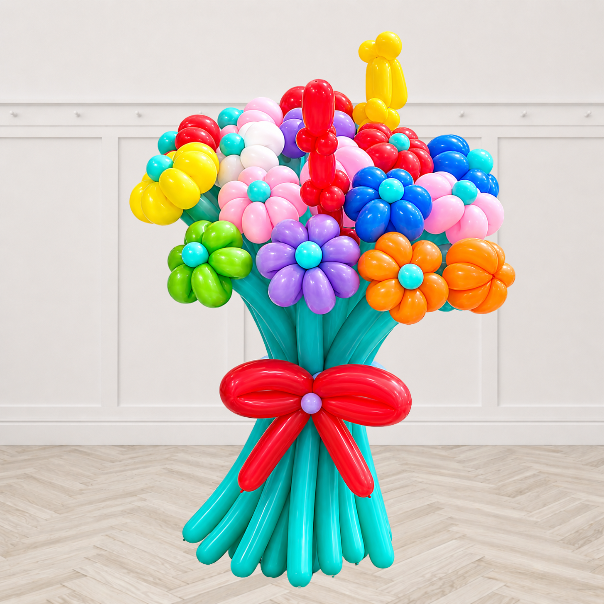 Colorful twisted balloon flower bouquet with red bow