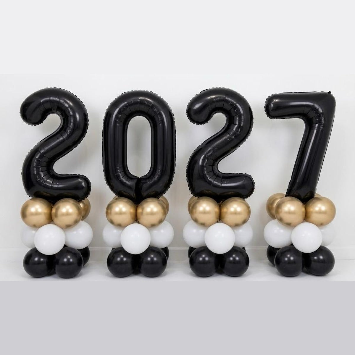 2027 New Year black number foil balloon columns on gold, white and black latex bases