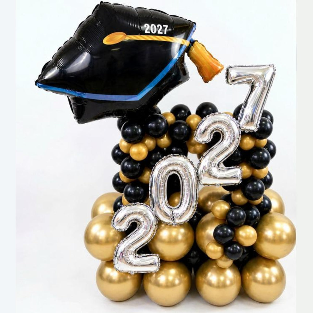Class of 2027 graduation cap foil and latex balloon tower in black and gold