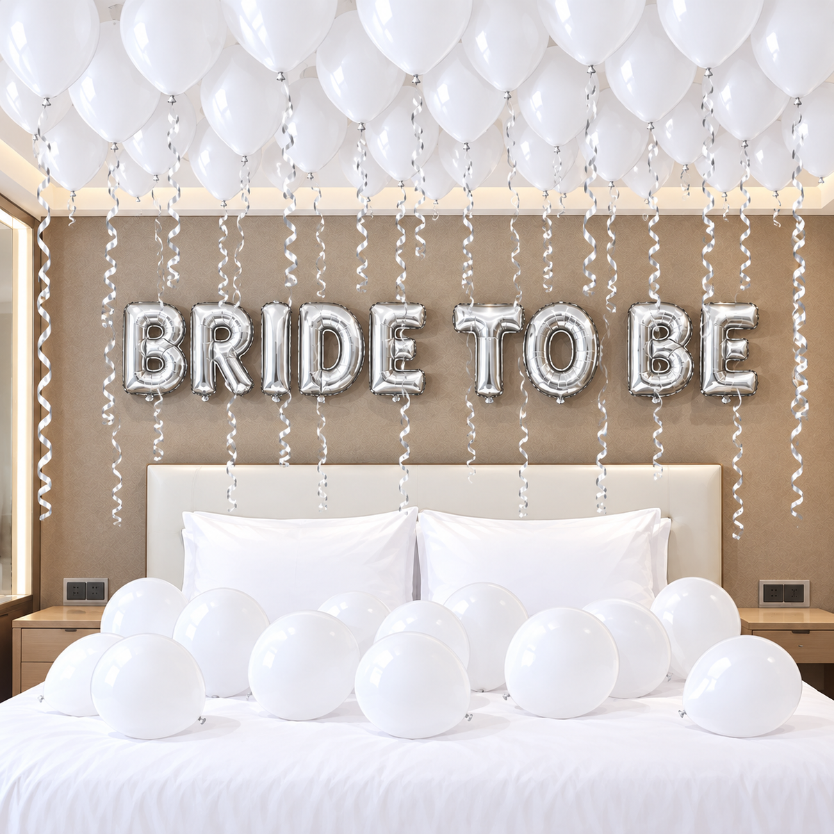 Silver bride to be letter banner with white latex balloons on ceiling and bed