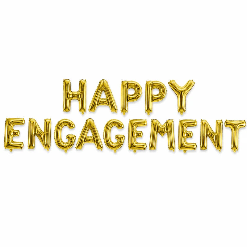 Gold alphabet foil balloon banner spelling Happy Engagement