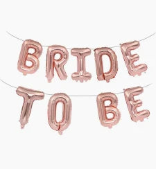 Rose gold alphabet foil balloon banner spelling Bride to Be