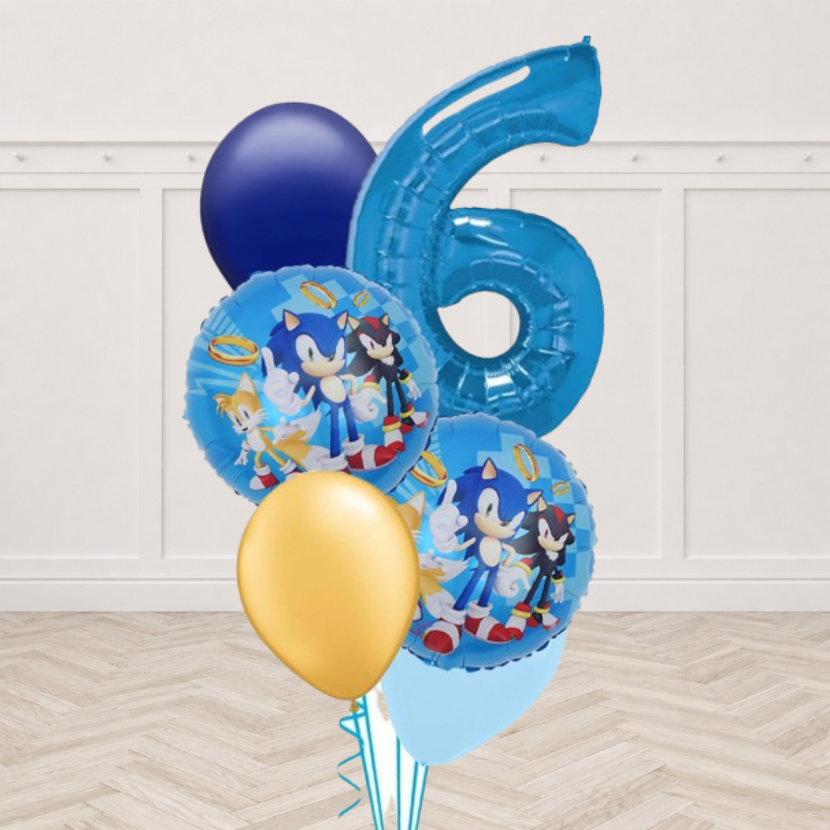 Blue giant number balloon with Sonic and Shadow foil balloons and navy and gold latex