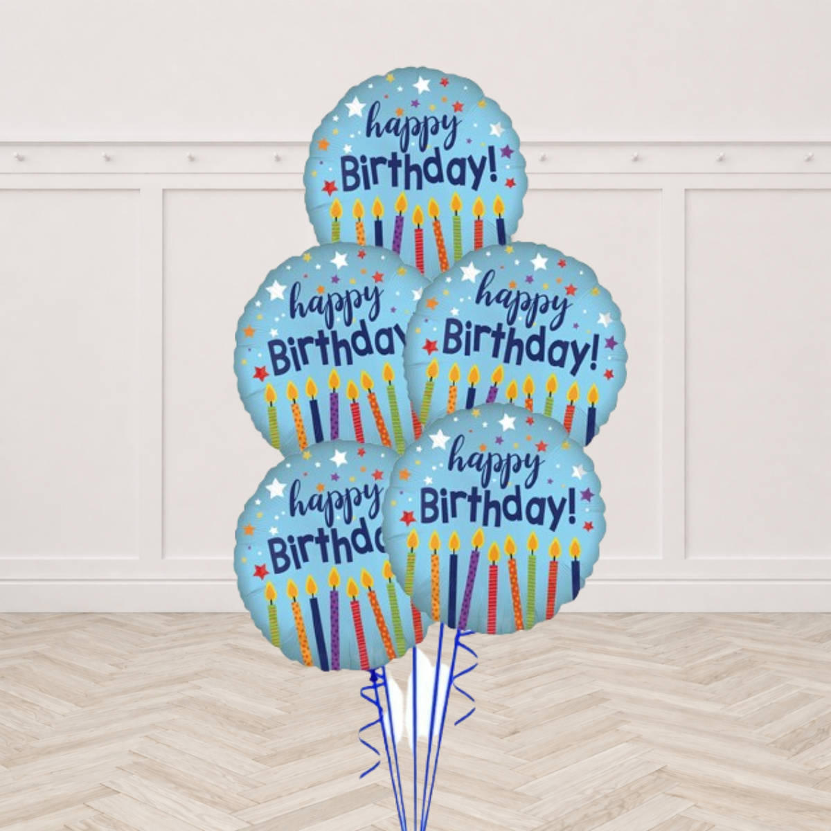 Five pale blue Happy Birthday foil balloons printed with candles and stars