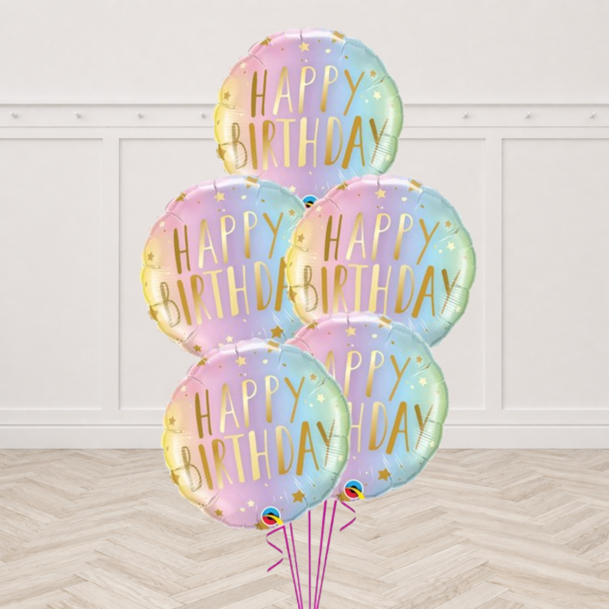 Five pastel ombre Happy Birthday foil balloons with gold lettering