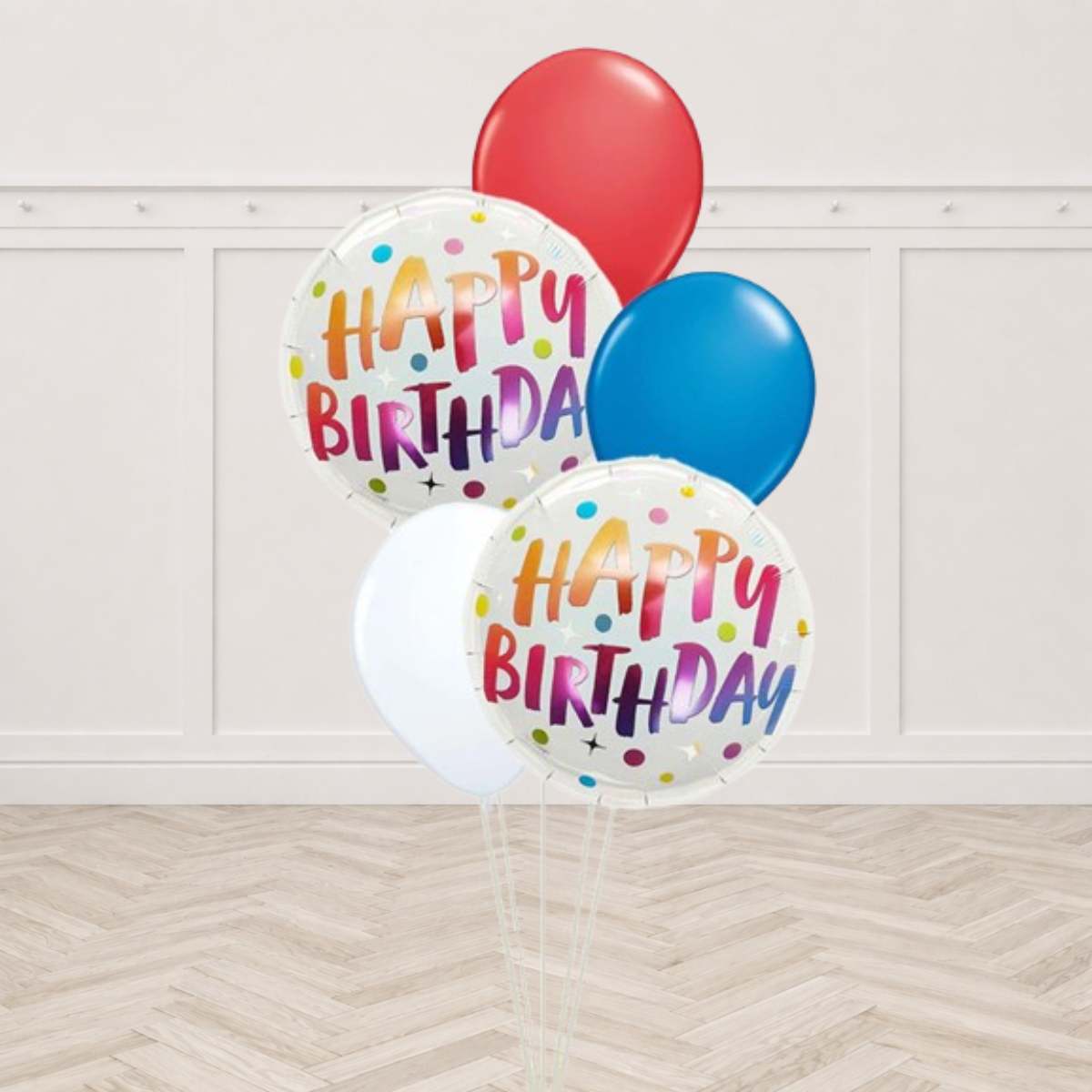 Two Happy Birthday foil balloons with rainbow lettering and red, blue and white latex