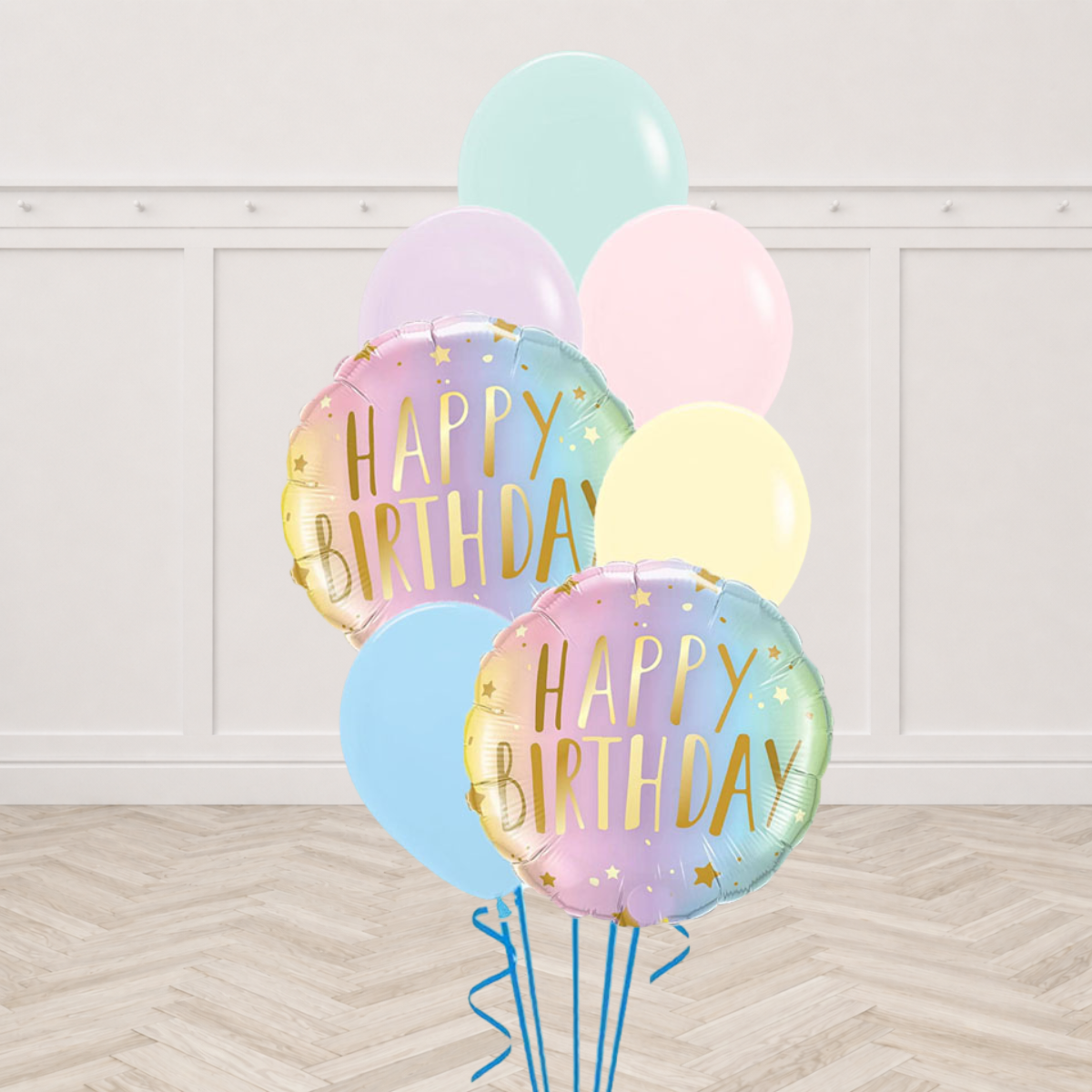 Two ombre Happy Birthday foil balloons with pastel latex balloons