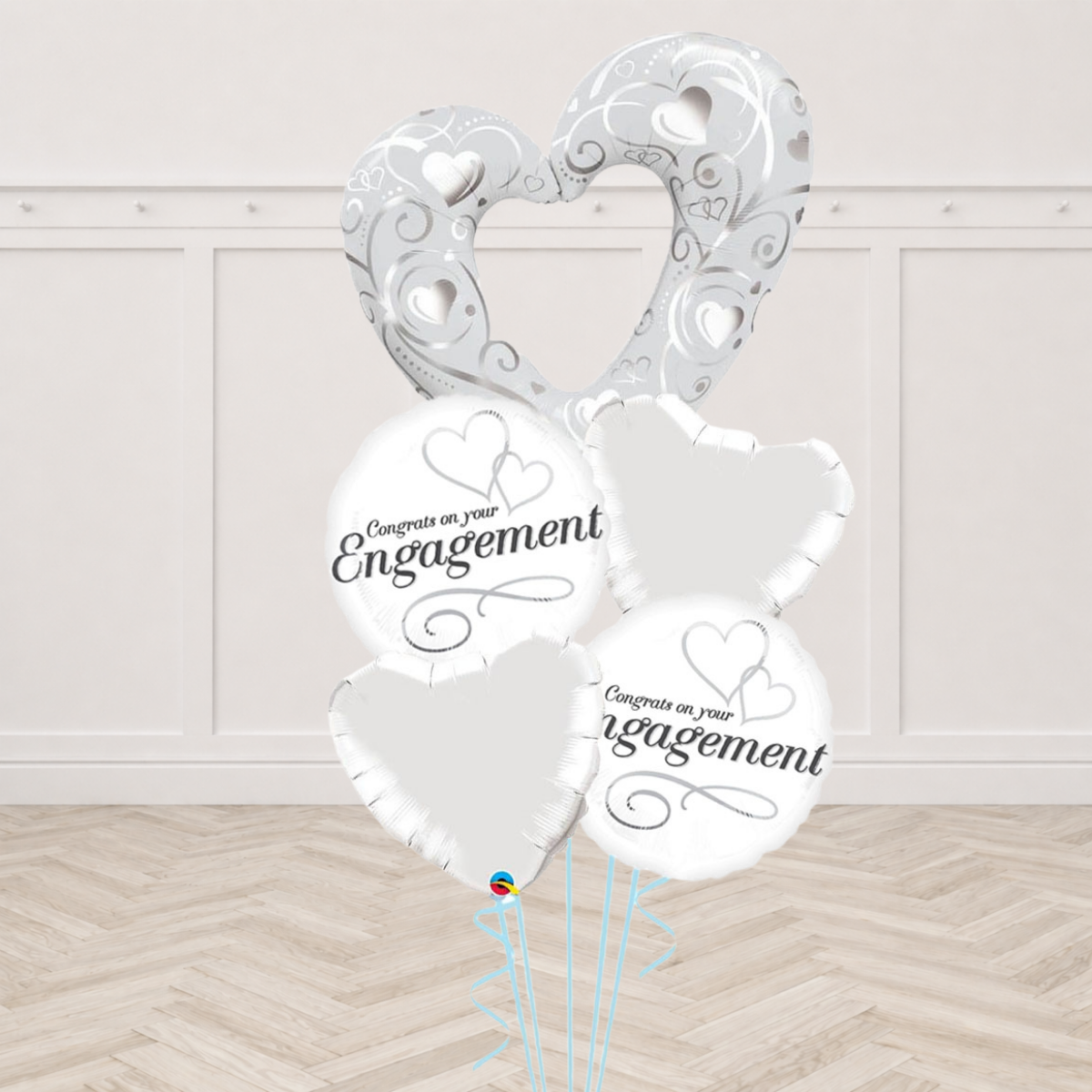 Silver open heart foil balloon with Congrats on Your Engagement round foil balloons and white heart foil balloons