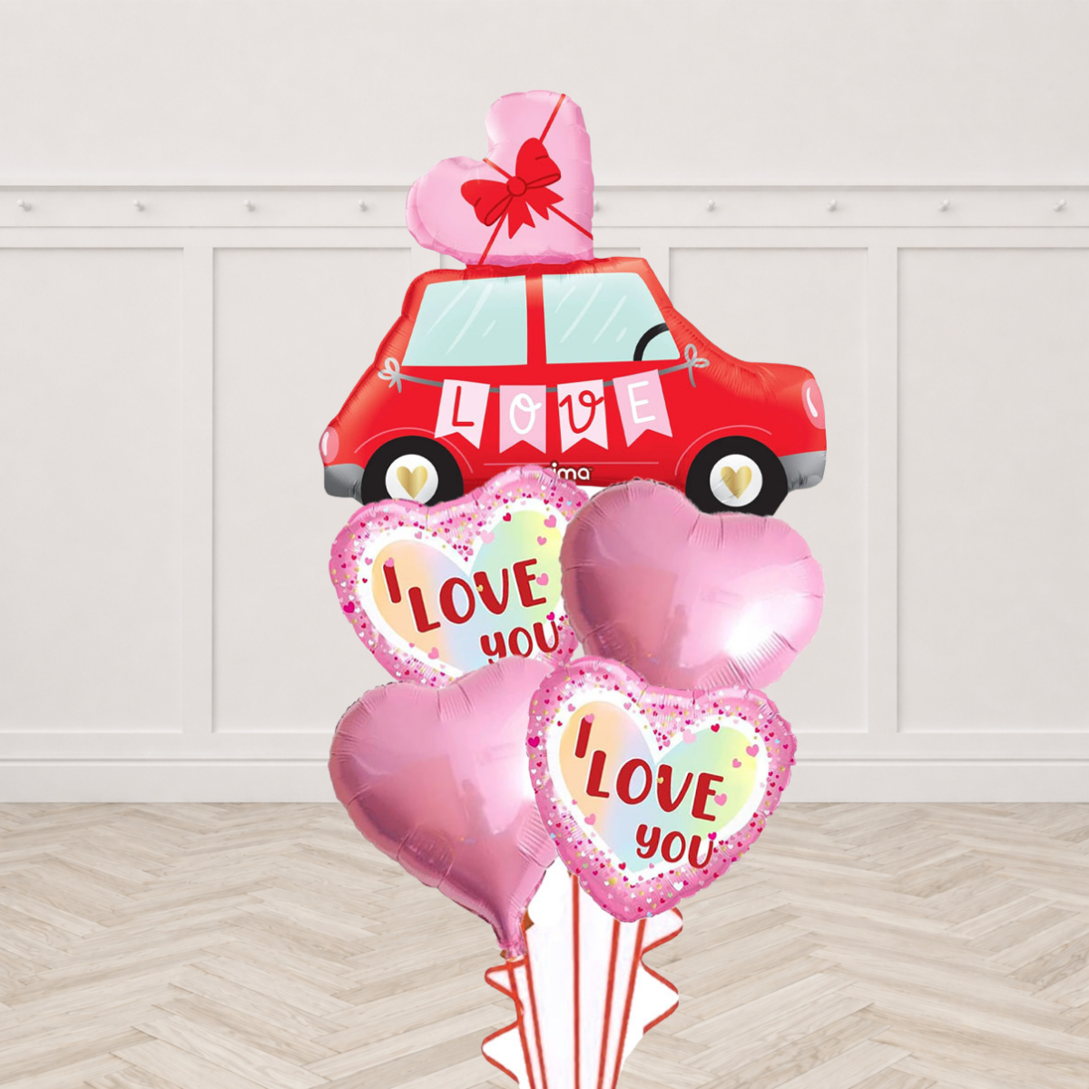 Red Love car foil balloon with a heart bow topper, plain pink heart foil balloons and I Love You heart foil balloons