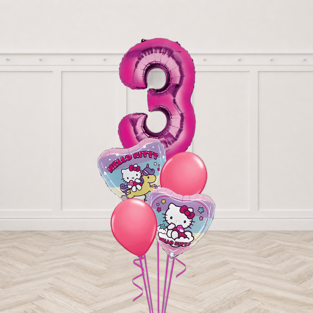 Hello Kitty birthday balloon bouquet with pink number foil balloon, two Hello Kitty heart balloons and two plain pink round balloons