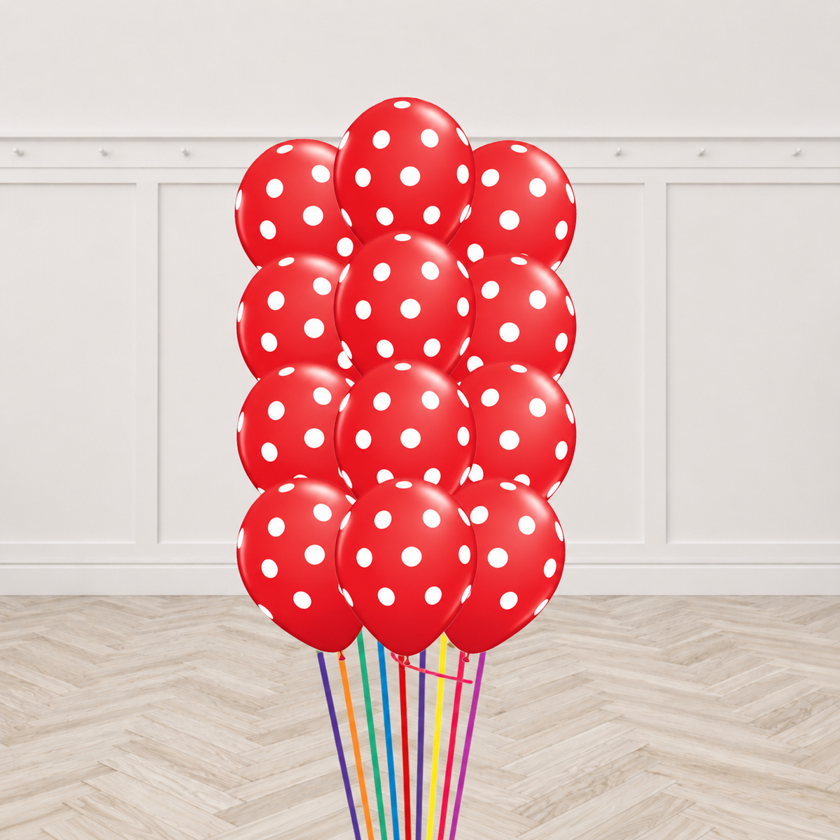 Twelve red latex balloons printed with white polka dots, tied together in a bouquet