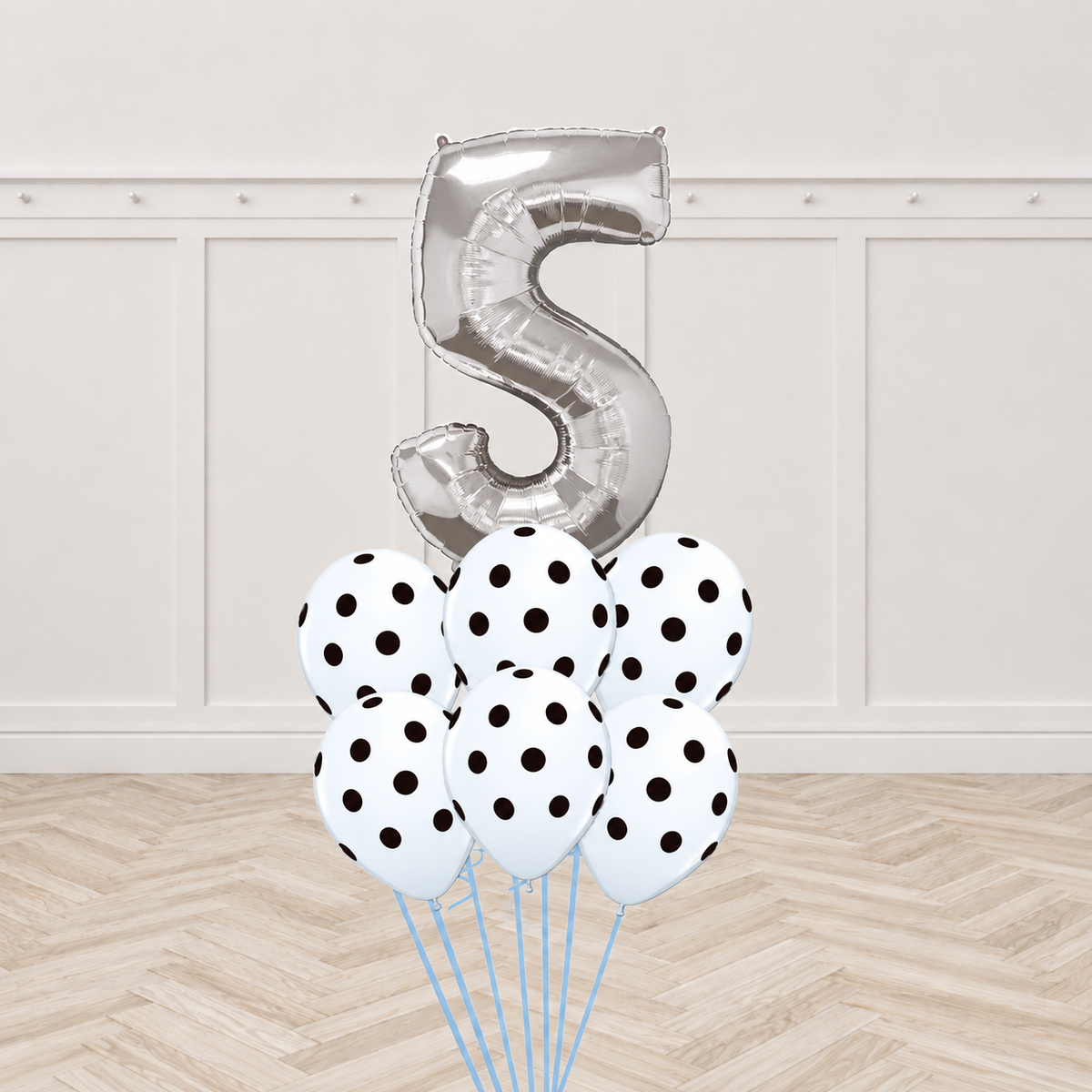 Silver number foil balloon with six white polka-dot latex balloons in a bouquet