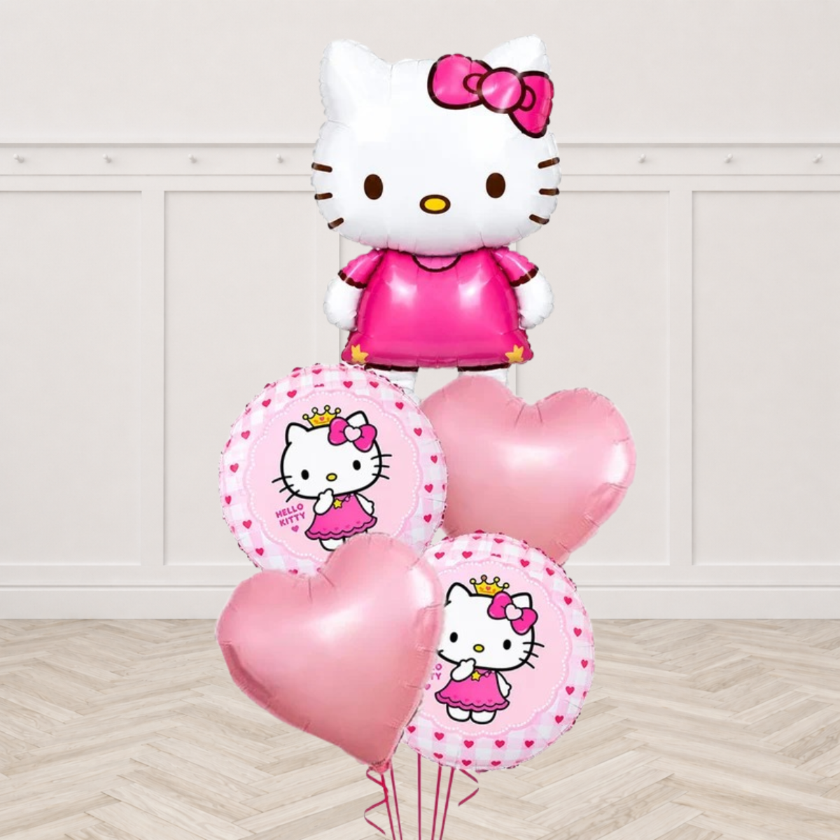 Hello Kitty character foil balloon with two round Hello Kitty print balloons and two pale pink heart balloons