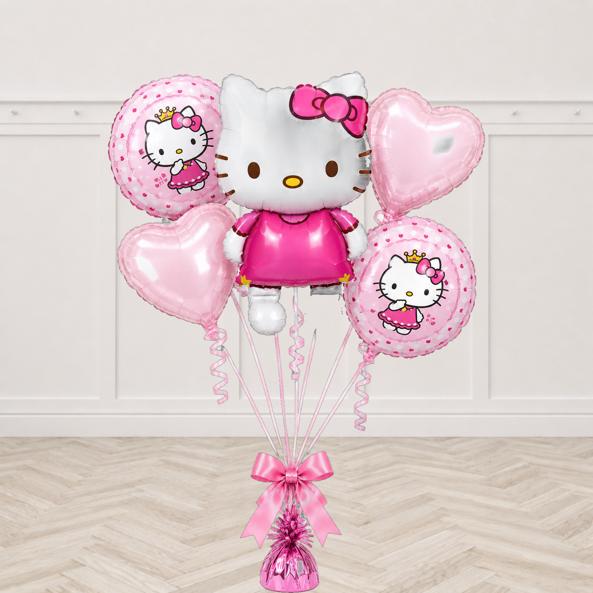 Large Hello Kitty character foil balloon with two round Hello Kitty print balloons and two pale pink heart balloons