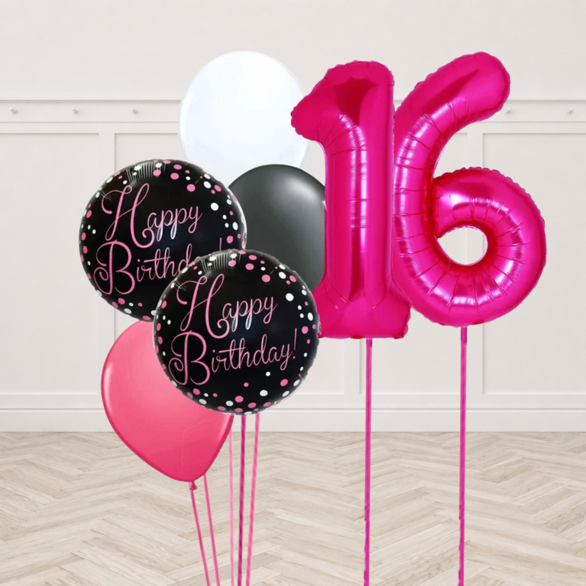 Hot pink number 1 and 6 foil balloons with two black round foil balloons printed Happy Birthday in pink script and white black and pink latex balloons on pink ribbons