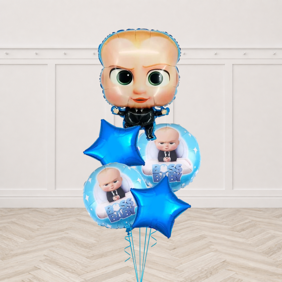 Boss Baby shaped foil balloon with two light blue round Boss Baby foil balloons and two blue star foils on blue ribbons