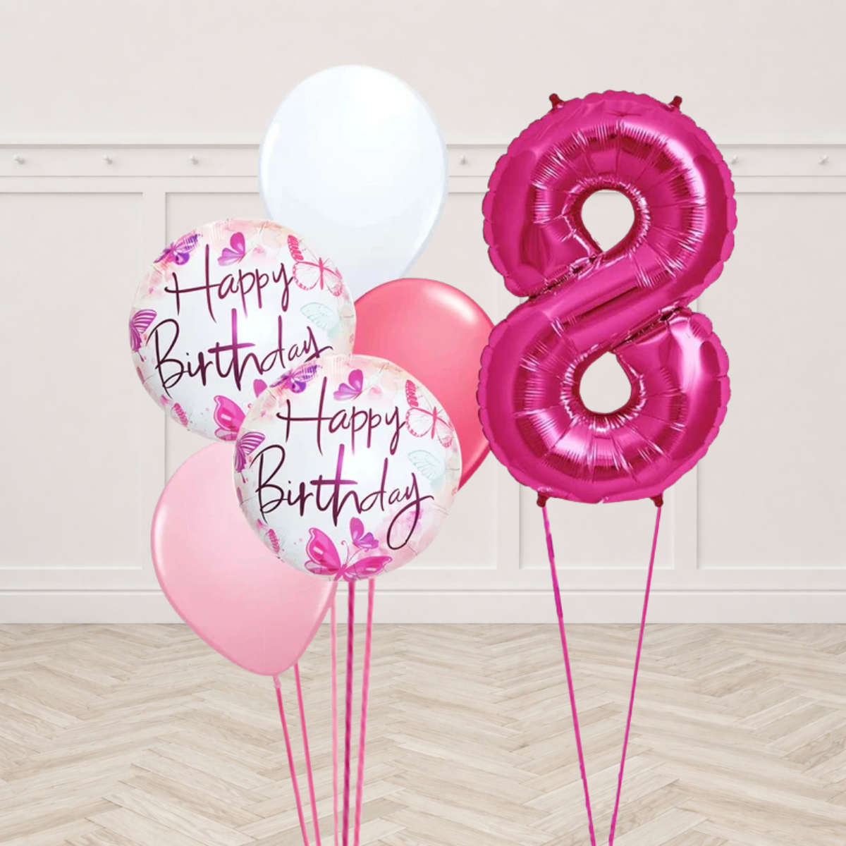 Hot pink number 8 foil balloon with two white round foil balloons printed Happy Birthday with pink and purple butterflies and white dark pink and light pink latex balloons on pink ribbons
