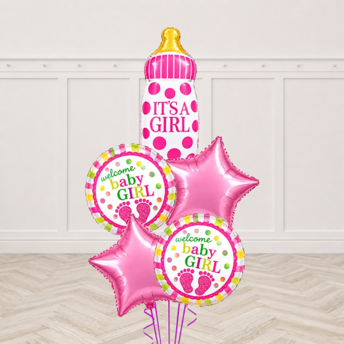 Baby bottle shaped foil balloon printed Its a Girl with two round Welcome Baby Girl foil balloons and two pink star foils on purple ribbons